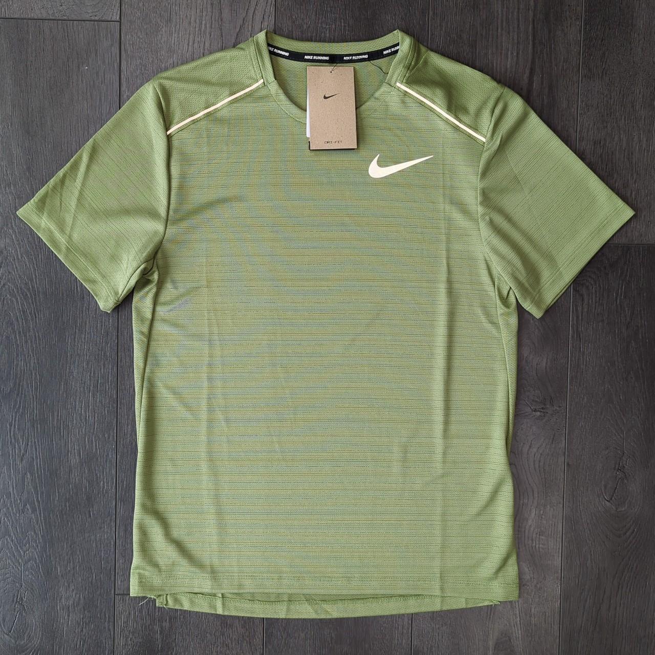 Mint green nike on sale top